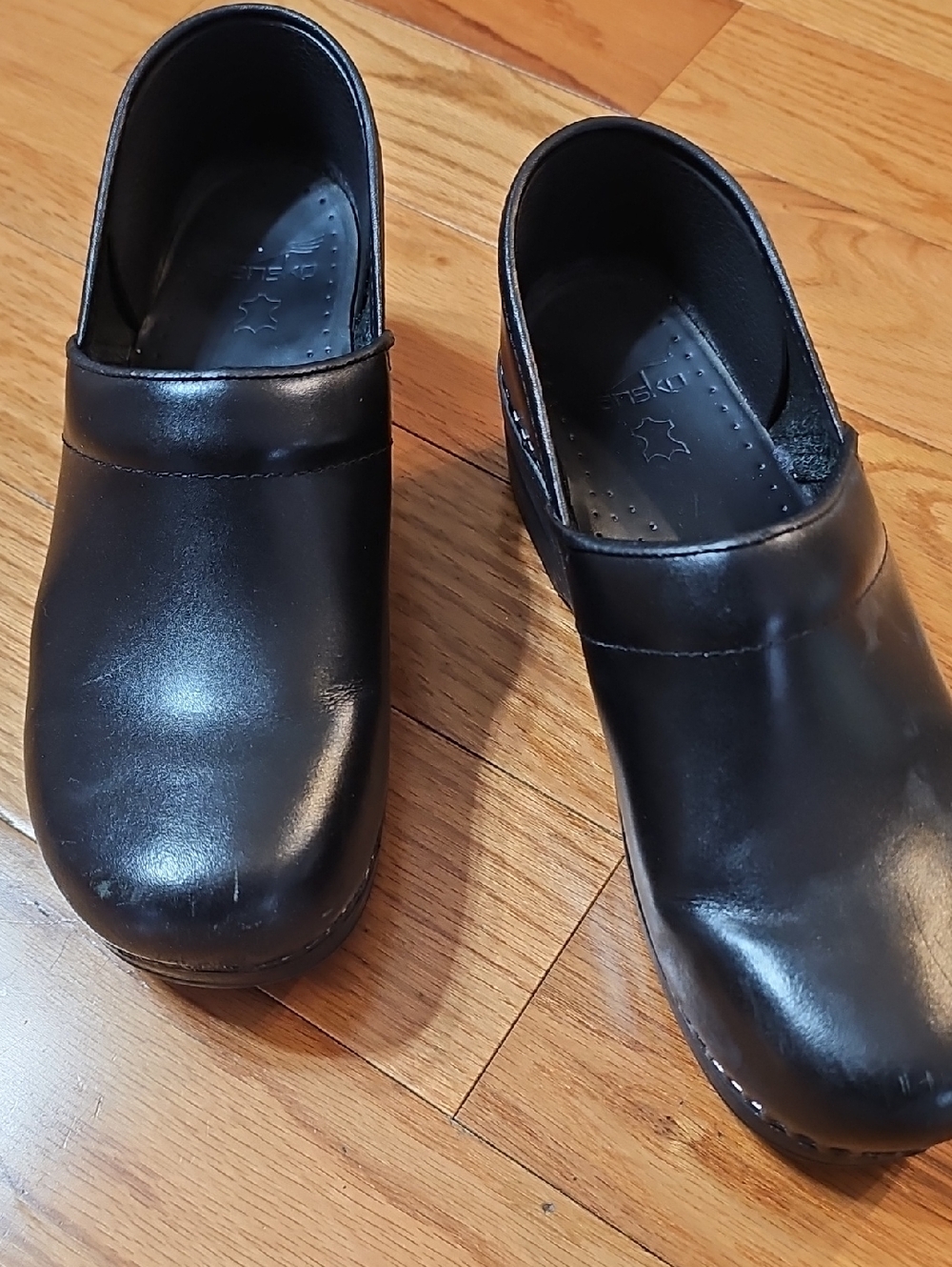 Dansko Black Leather Slip-On Clogs